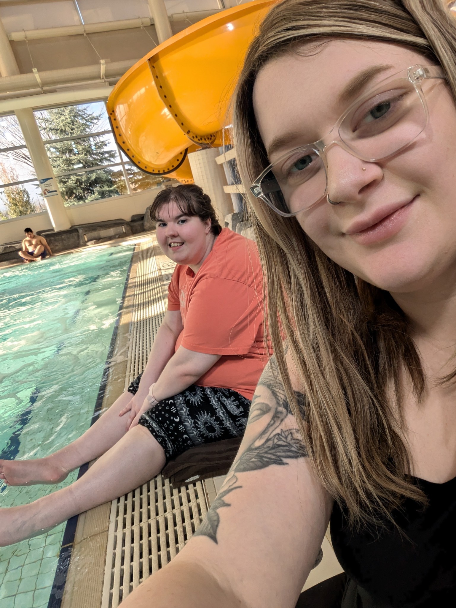 adult and student at swimming pool